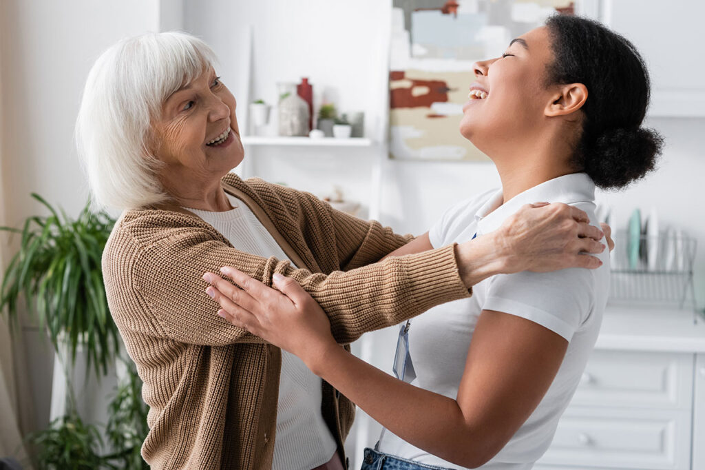 Older Woman and Daughter Talking and Laughing